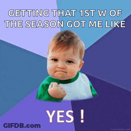 A Baby With A Fist In The Air With The Words Getting That 1St W Of The Season Got Me Like Yes GIF