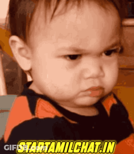 A Baby With An Angry Look On His Face And The Words Starttamilchat.in Above Him GIF