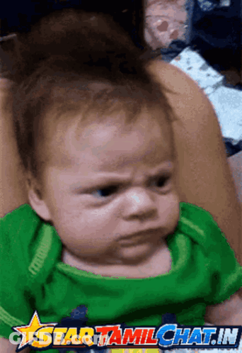 A Baby With An Angry Look On His Face Is On A Star Tamil Chat.in Advertisement GIF