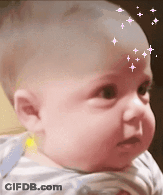 A Baby With Stars On His Forehead Looks At The Camera GIF