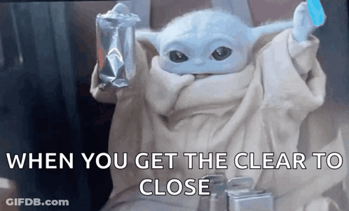 A Baby Yoda From Star Wars Is Holding A Bag Of Food And A Toothbrush . GIF