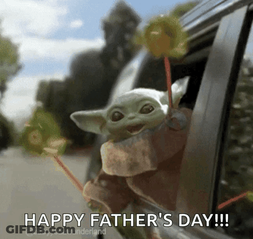 A Baby Yoda Is Sticking Its Head Out Of A Car Window And Holding Lollipops . GIF