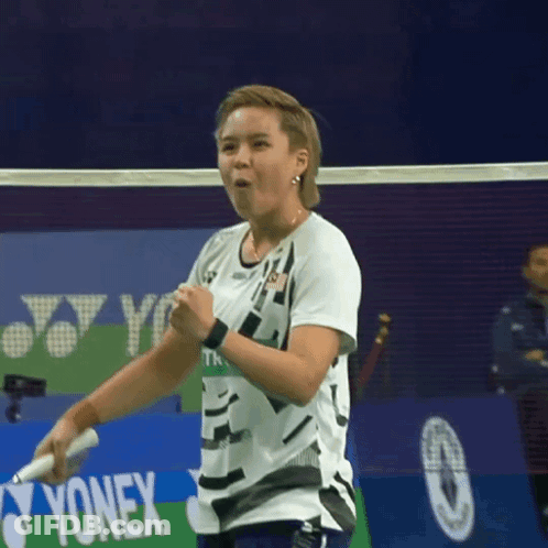 A Badminton Player With A Yonex Logo In The Background GIF