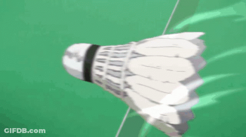 A Badminton Shuttlecock Is Flying Through The Air With Chinese Writing Behind It GIF