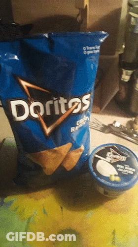 A Bag Of Doritos Lays On A Table Next To A Container Of Sour Cream GIF