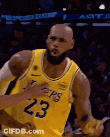 A Bald Basketball Player Wearing A Yellow Jersey With The Number 23 On It GIF