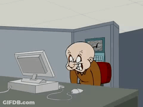 A Bald Cartoon Character Is Sitting At A Desk Looking At A Computer Screen . GIF