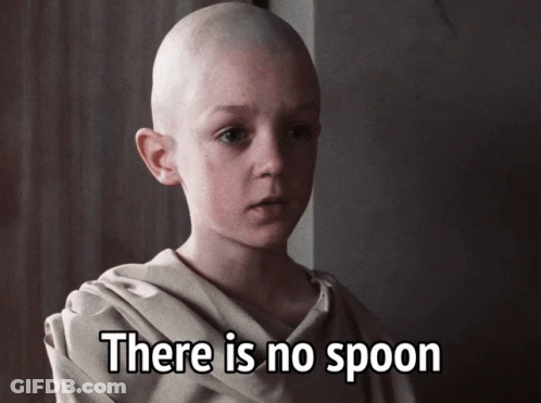 A Bald Child With The Words There Is No Spoon Written Below Him GIF