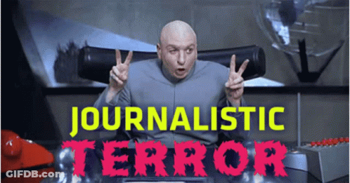 A Bald Man Giving A Peace Sign In Front Of A Sign That Says ' Journalismic Terror ' GIF