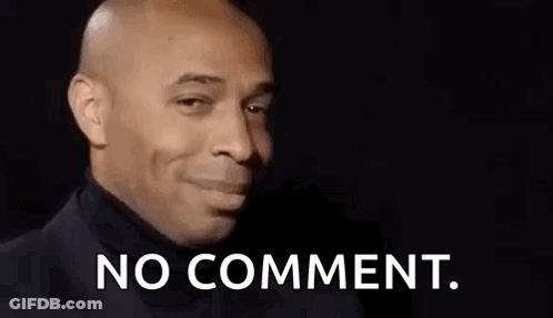 A Bald Man In A Black Turtleneck Is Making A Funny Face And Saying No Comment . GIF