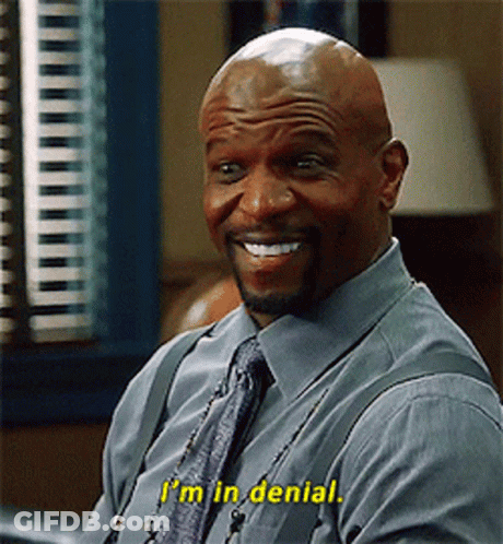 A Bald Man In A Blue Shirt And Tie Is Smiling And Says I 'M In Denial GIF