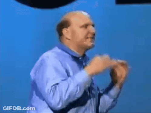 A Bald Man In A Blue Shirt Is Dancing With The Word Expeditions Written On His Shirt GIF