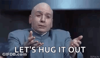 A Bald Man In A Blue Suit Is Making A Funny Face And Says `` Let 'S Hug It Out '' . GIF