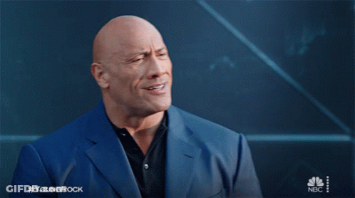 A Bald Man In A Blue Suit With The Hashtag Youngrock GIF
