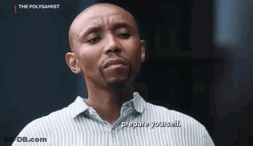 A Bald Man In A Striped Shirt Is Talking To Someone And Says `` Prepare Yourself '' . GIF