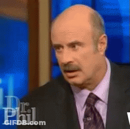 A Bald Man In A Suit And Tie Is On Dr Phil GIF