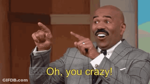 A Bald Man In A Suit And Tie Is Pointing At Something And Saying `` Oh , You Crazy ! '' GIF
