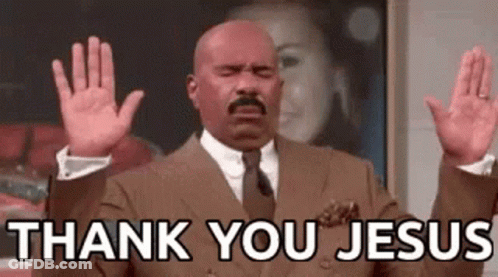 A Bald Man In A Suit And Tie Is Raising His Hands In The Air And Saying `` Thank You Jesus '' . GIF