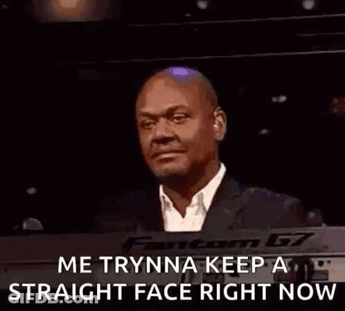 A Bald Man In A Suit And Tie Is Smiling And Says `` Me Trynna Keep A Straight Face Right Now '' . GIF