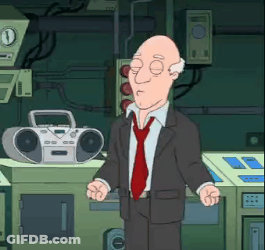 Bald Man In Suit And Tie Standing In Front Of Boombox GIF