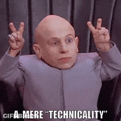 A Bald Man In A Suit Is Making A Peace Sign With His Hands While Sitting In A Chair . GIF