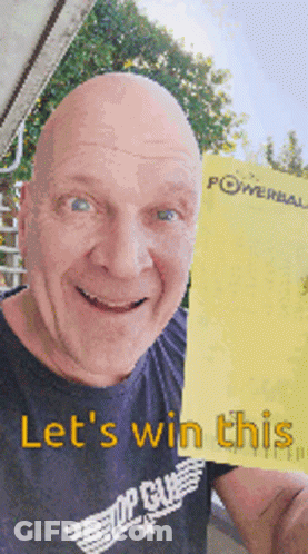 A Bald Man In A Top Gun Shirt Is Holding Up A Yellow Powerball Ticket GIF
