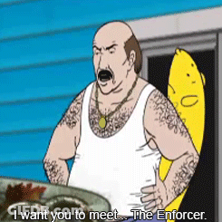 Bald Man In White Tank Top Next To Banana GIF
