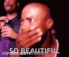 A Bald Man Is Covering His Mouth With His Hand And The Words `` So Beautiful '' Written On The Bottom . GIF