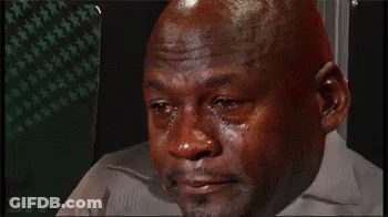 A Bald Man Is Crying With Tears Running Down His Face While Wearing A White Shirt . GIF