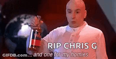 A Bald Man Is Holding A Bottle Of Soda In His Hand And Saying `` Rip Chris G And One For My Homies '' . GIF