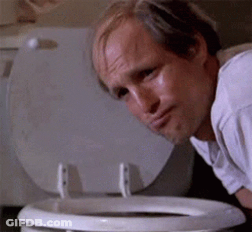 A Bald Man Is Looking Into A Toilet Bowl . GIF
