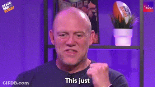 A Bald Man Is Making A Fist And Saying `` This Just '' In Front Of A Purple Background . GIF
