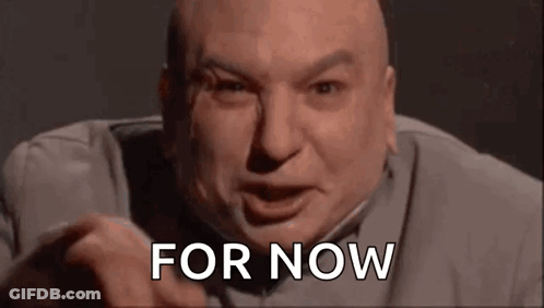 A Bald Man Is Making A Funny Face And Pointing At The Camera While Saying `` For Now '' . GIF