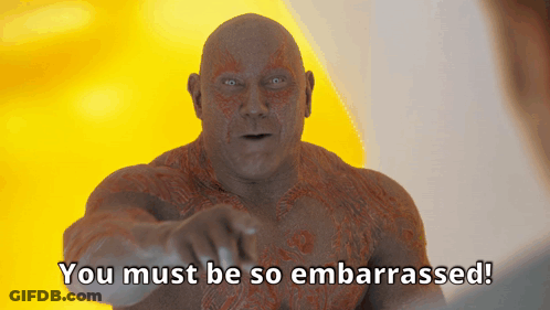 A Bald Man Is Pointing At The Camera With The Words You Must Be So Embarrassed Below Him GIF