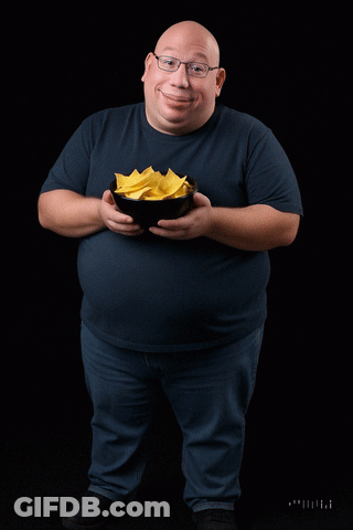 A Bald Man Is Pouring Yellow Liquid Into A Bowl Of Food GIF
