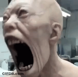A Bald Man Is Screaming With His Mouth Open . GIF