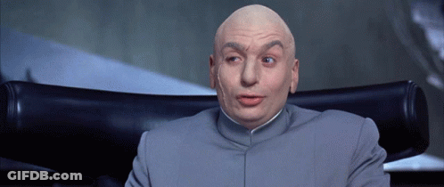 A Bald Man Is Sitting In A Chair With His Mouth Open GIF