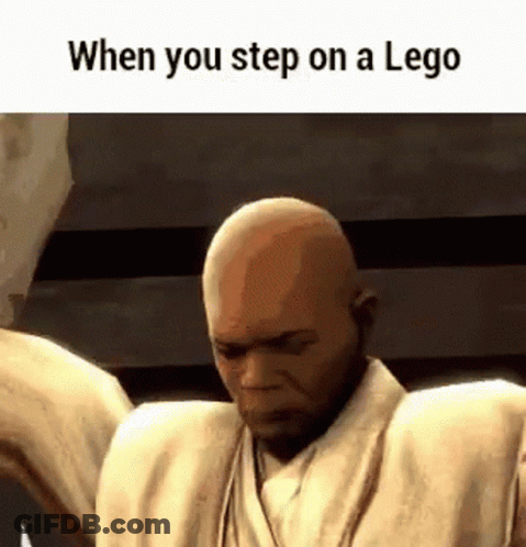 A Bald Man Is Standing In Front Of A Wall With His Arms Outstretched . GIF