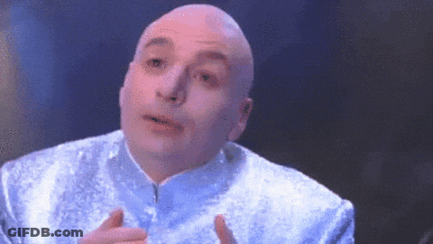 A Bald Man Is Wearing A Blue Jacket And Making A Face GIF