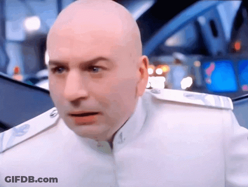 A Bald Man Is Wearing A White Uniform With A Badge On The Shoulder GIF