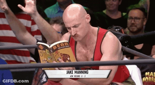 A Bald Man Reading A Book Called Bear GIF