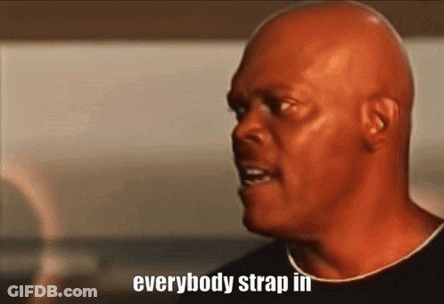 A Bald Man Says " Everybody Strap In " In A Close Up GIF