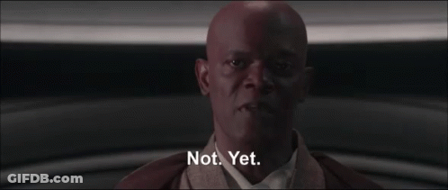 A Bald Man Says Not Yet In A Dark Room GIF