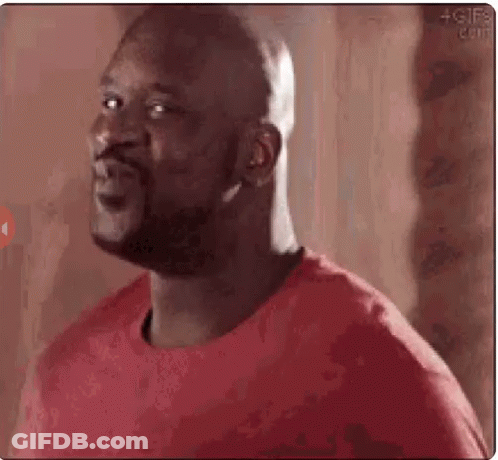 A Bald Man Wearing A Red Shirt Is Making A Funny Face . GIF