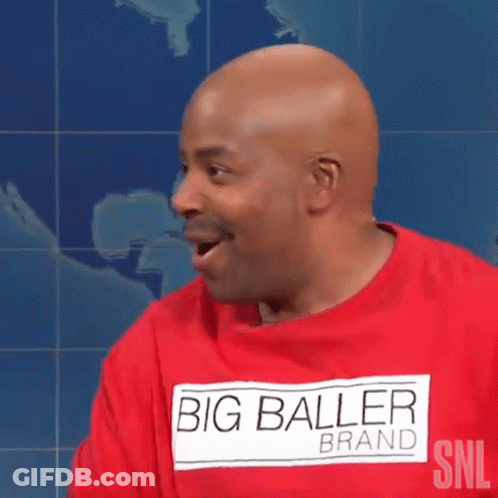 A Bald Man Wearing A Red Shirt That Says " Big Baller Brand " GIF