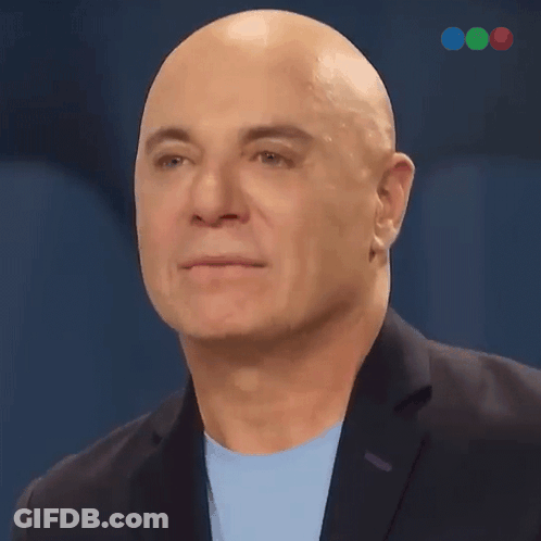 Bald Man In Suit And Light Blue Shirt GIF