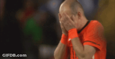 A Bald Man Wearing An Orange Shirt With The Number 11 On The Front GIF