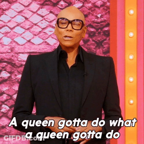 A Bald Man Wearing Glasses And A Black Suit Says A Queen Gotta Do What A Queen Gotta Do GIF