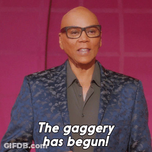A Bald Man Wearing Glasses And A Blue Jacket Says The Gaggery Has Begun GIF