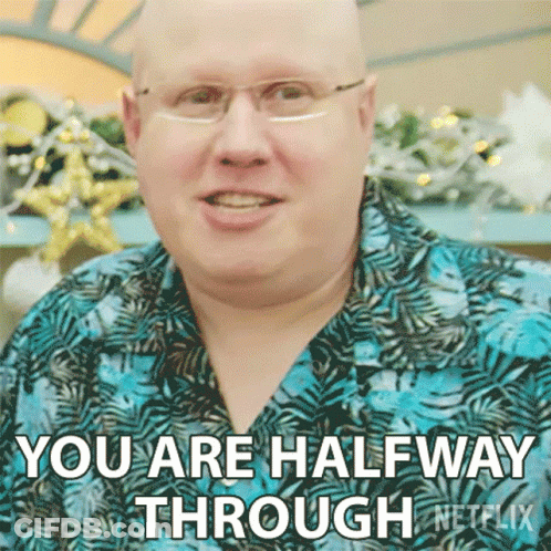 A Bald Man Wearing Glasses And A Blue Shirt Is Saying You Are Halfway Through Netflix GIF